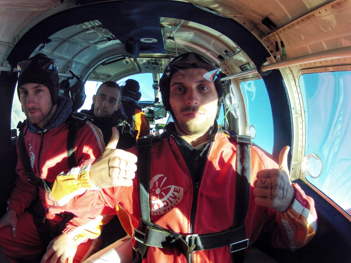 Skydiving in Wanaka Experience: My First Ever Skydive in NZ! | inside skydiving plane 2 men looking nervous in a skydiving plane
