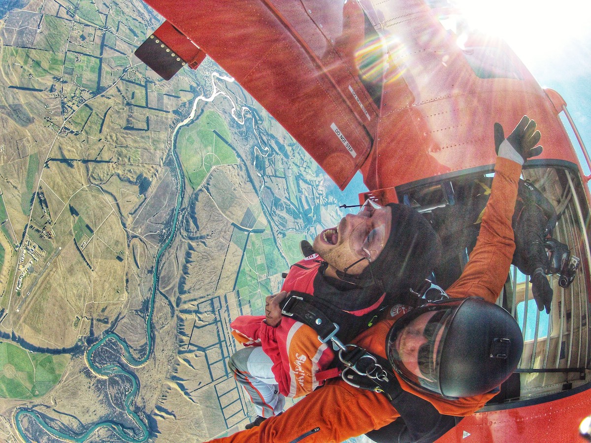 Skydiving in Wanaka Experience: My First Ever Skydive in NZ! | skydive wanaka jumping out of plane A man screams as he jumps out of skydiving plane.