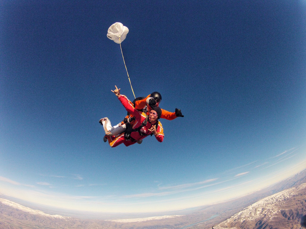 Skydiving in Wanaka Experience: My First Ever Skydive in NZ! | skydive wanaka a man poses during a skydive pose.