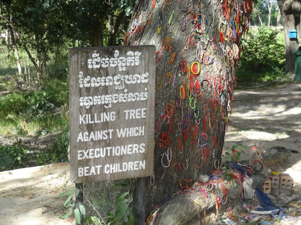 The Rise and Fall of The Khmer Rouge Regime in Cambodia | killing fields tree 1 Memorials hang from the killing tree in the killing fields of Cambodia