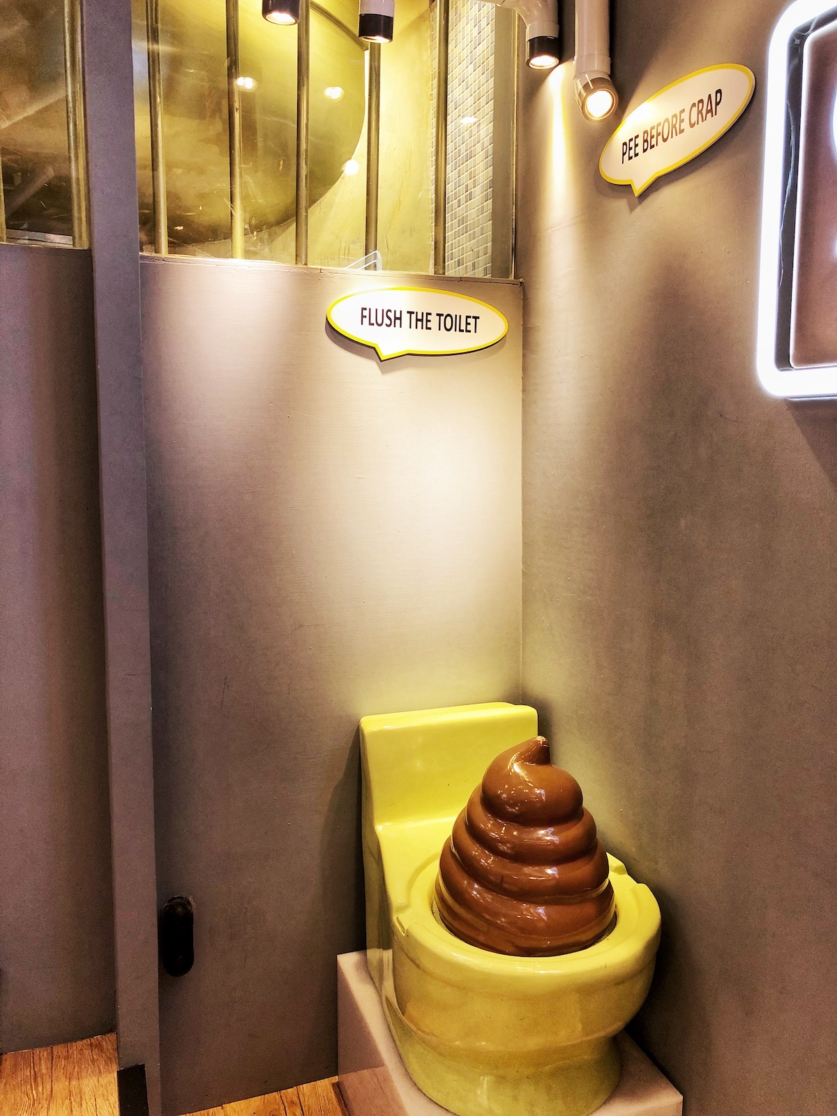 7 Unique & Fun Things To Do in Taipei (Guide For Weirdos!) | Poo cafe Taipei A plastic art of poo coming out of a toilet