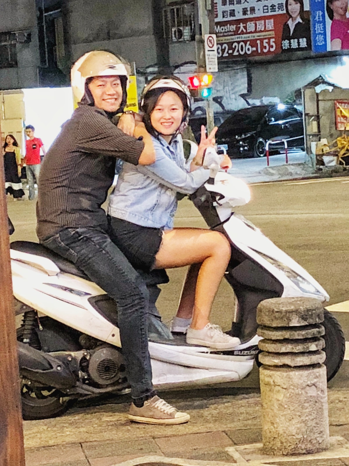 7 Unique & Fun Things To Do in Taipei (Guide For Weirdos!) | Taiwanese friends An Asian man and woman smile on a white scooter