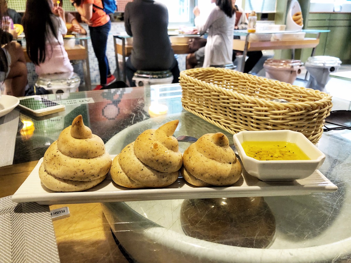7 Unique & Fun Things To Do in Taipei (Guide For Weirdos!) | moder toilet poo cafe food Pieces of bread in the shape of a poo