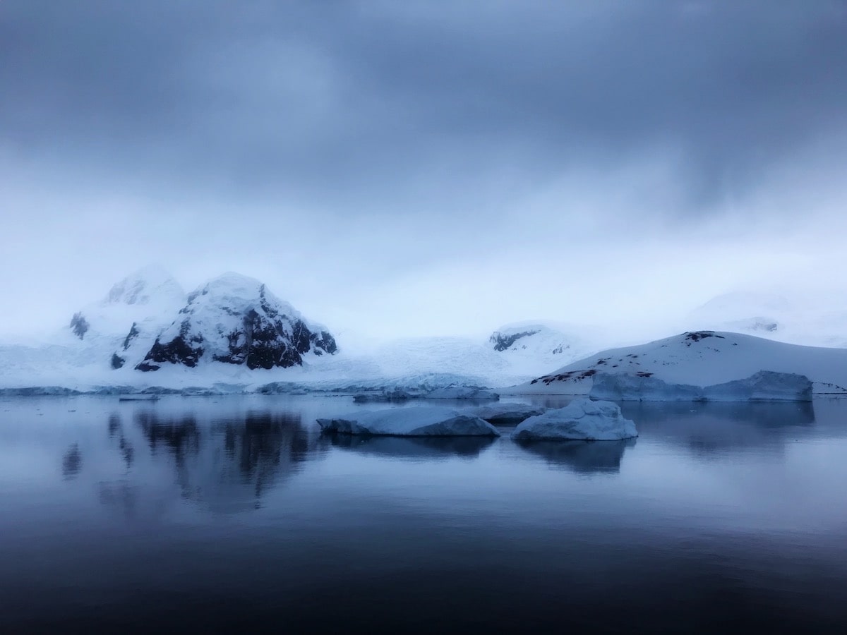3 Weeks Patagonia Itinerary For Argentina & Chile | Antarctica from water Misty view of snow-capped rocks in Antarctica