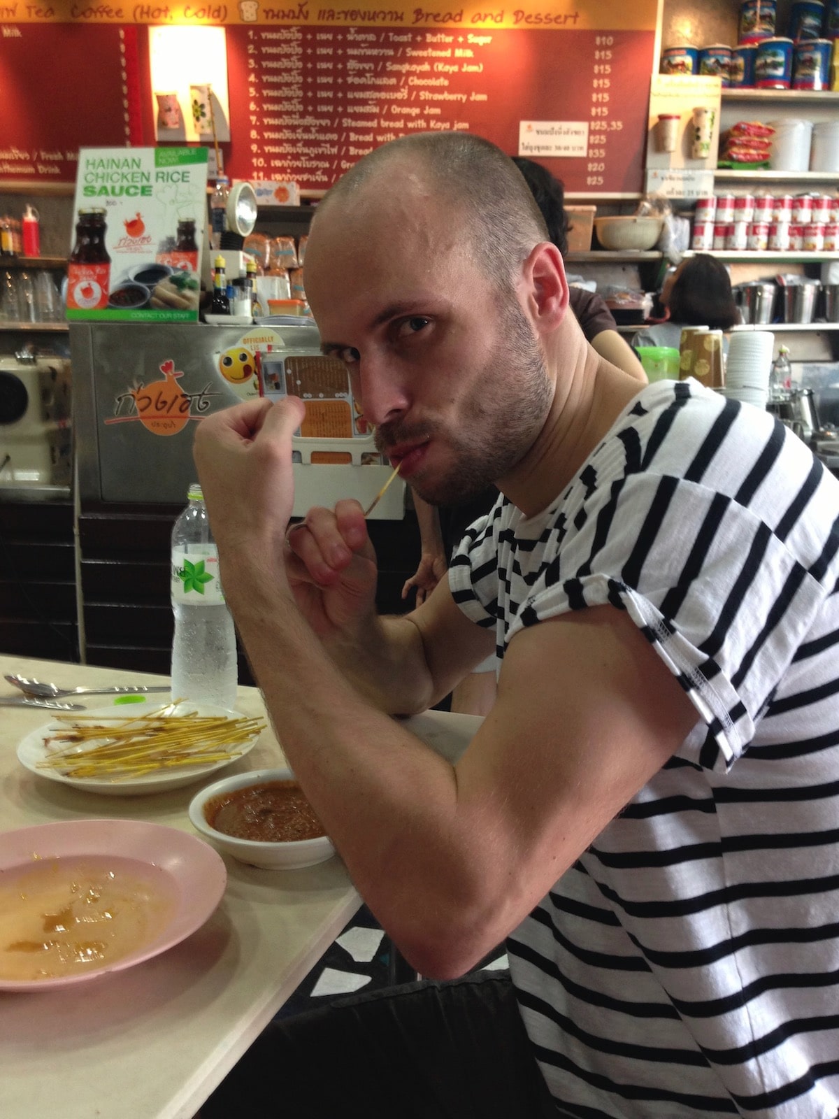 Cost of Living in Bangkok (& The Lies That Bloggers Tell) | cheap Thai food Tourist eating cheap Thai food in Bangkok