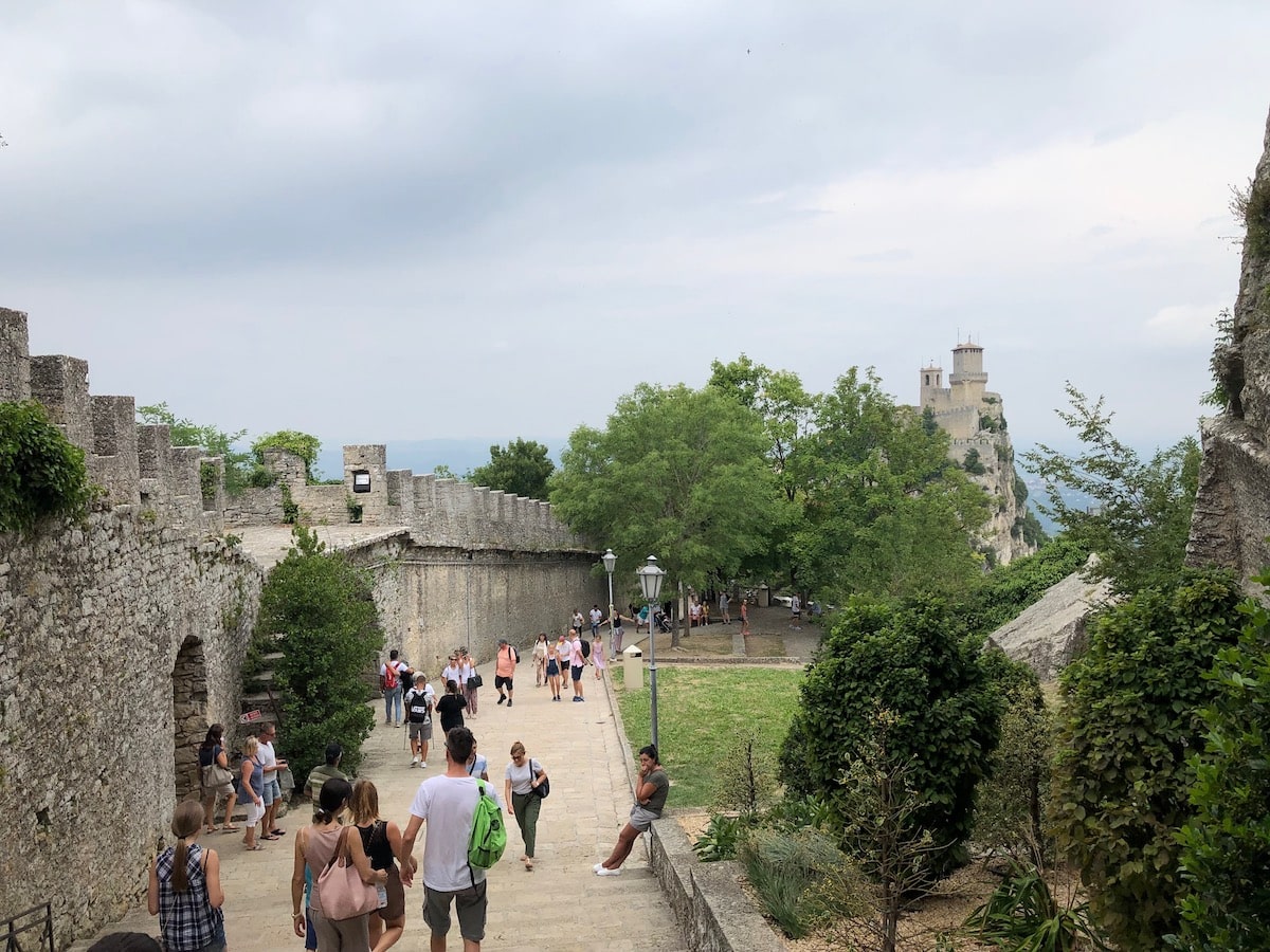 A Handy Guide To The 6 Microstates of Europe | inside Guaita Fortress San Marino People walking around Guaita Fortress, San Marino