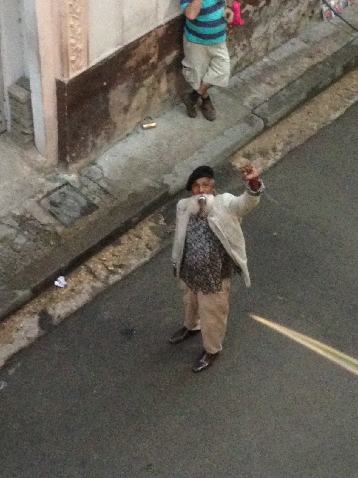One Day in Havana Itinerary - Best Things To See & Do! | old cuban man in havana Old Cuban man waving in downtown Havana
