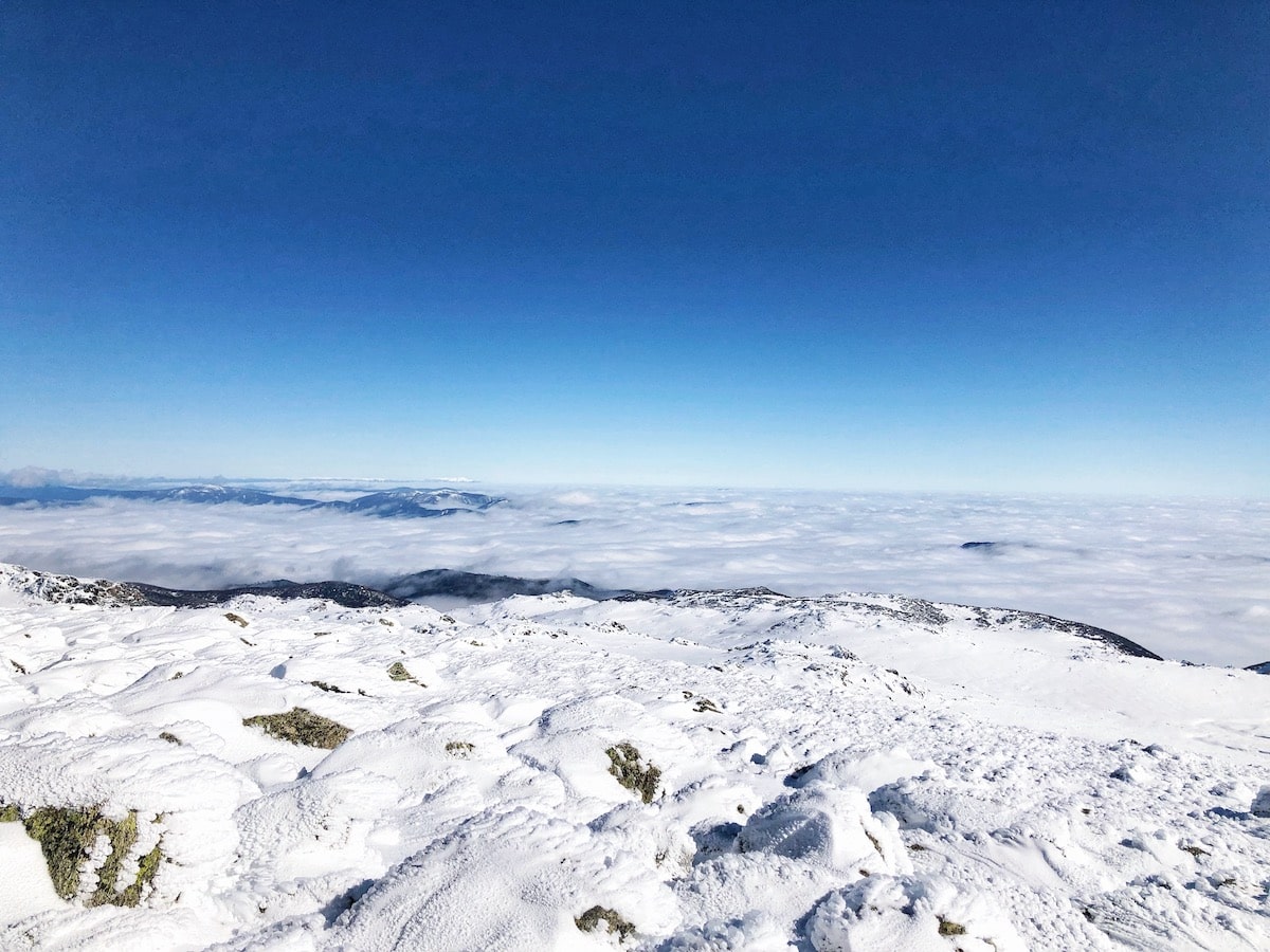Climbing Mount Kosciuszko in Winter | view from Mount Kosciuszko summit View from the summit of Mount Kosciuszko during an Australian winter