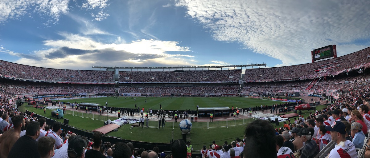 How To Buy Boca Juniors Tickets As A Tourist + Superclasico! | River Plate Stadium Estadio Monumental Antoni Vespucio Liberti Panoramic pitch side view on a clear day during a football match in Argentina.