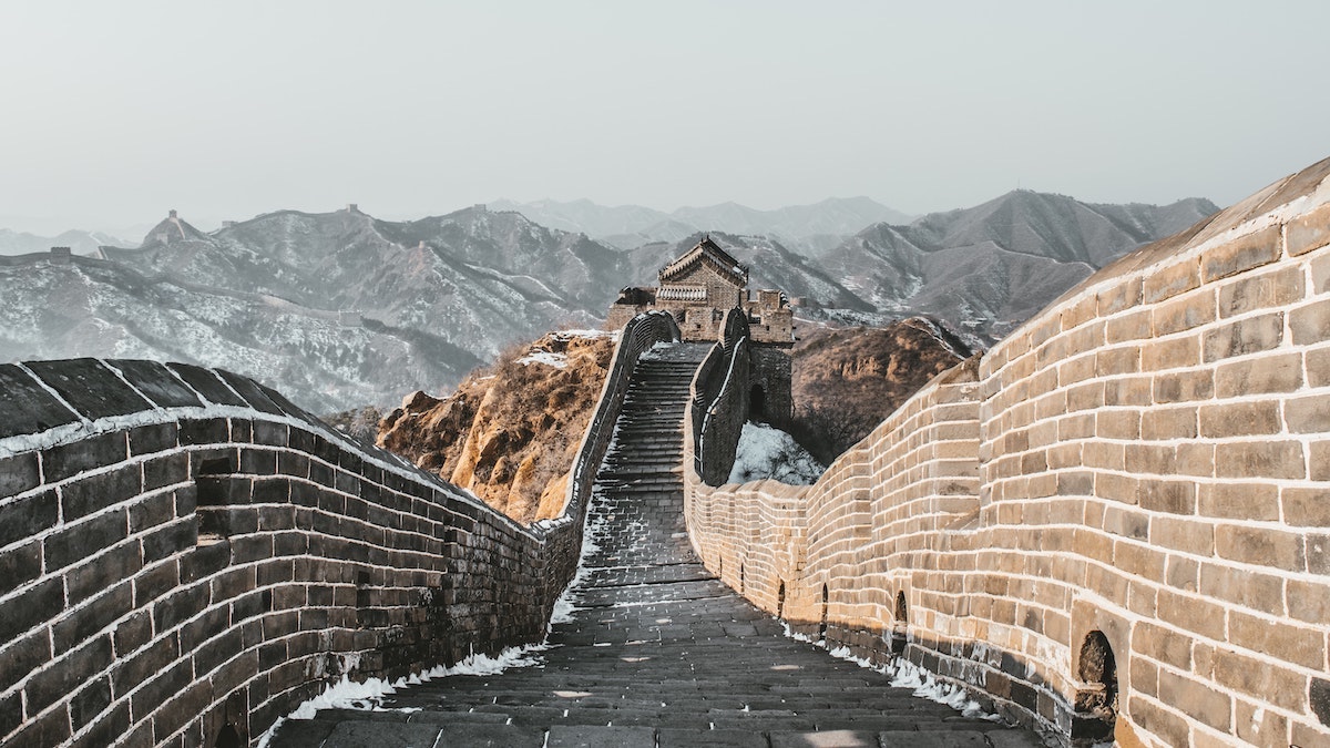Best Place To See Great Wall of China (No Crowds, No Worries!) | Simatai A snow-capped empty Great Wall of China.