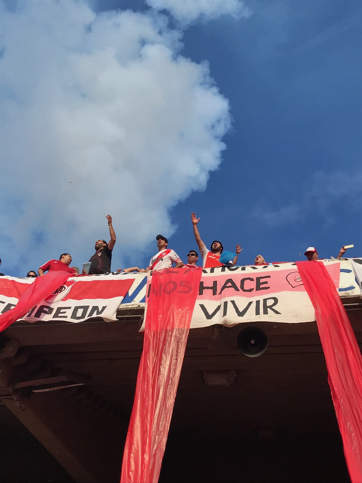How To Buy Boca Juniors Tickets As A Tourist + Superclasico! | nos hace vivir River Plate Football fans chant from the high terrace in Buenos Aires, Argentina.