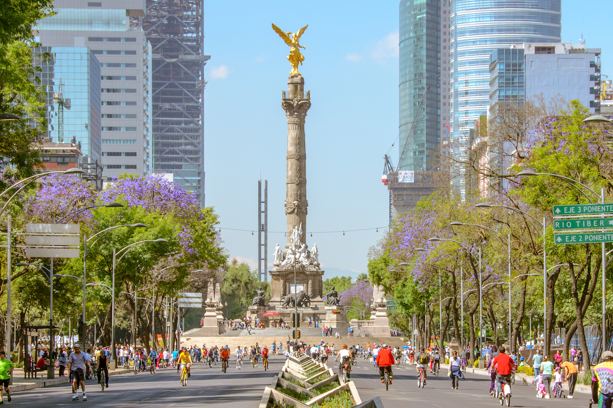 16 Famous Landmarks in Mexico (& How To See Them in 2024!) | Angel of Independence Mexico City Sunday´s bikers in Paseo de la Reforma at El Angel. In the background, the new Bancomer Tower and Reforma Tower buildings are under construction.
