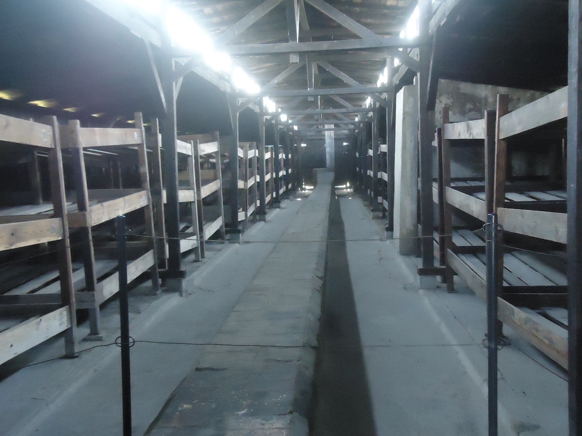 Visiting Auschwitz: All You Need To Know & What To Expect | Auschwitz bunk beds The rooms that the victims of Auschwitz had to sleep in during the Holocaust are now empty and shown in the Auschwitz Museum.