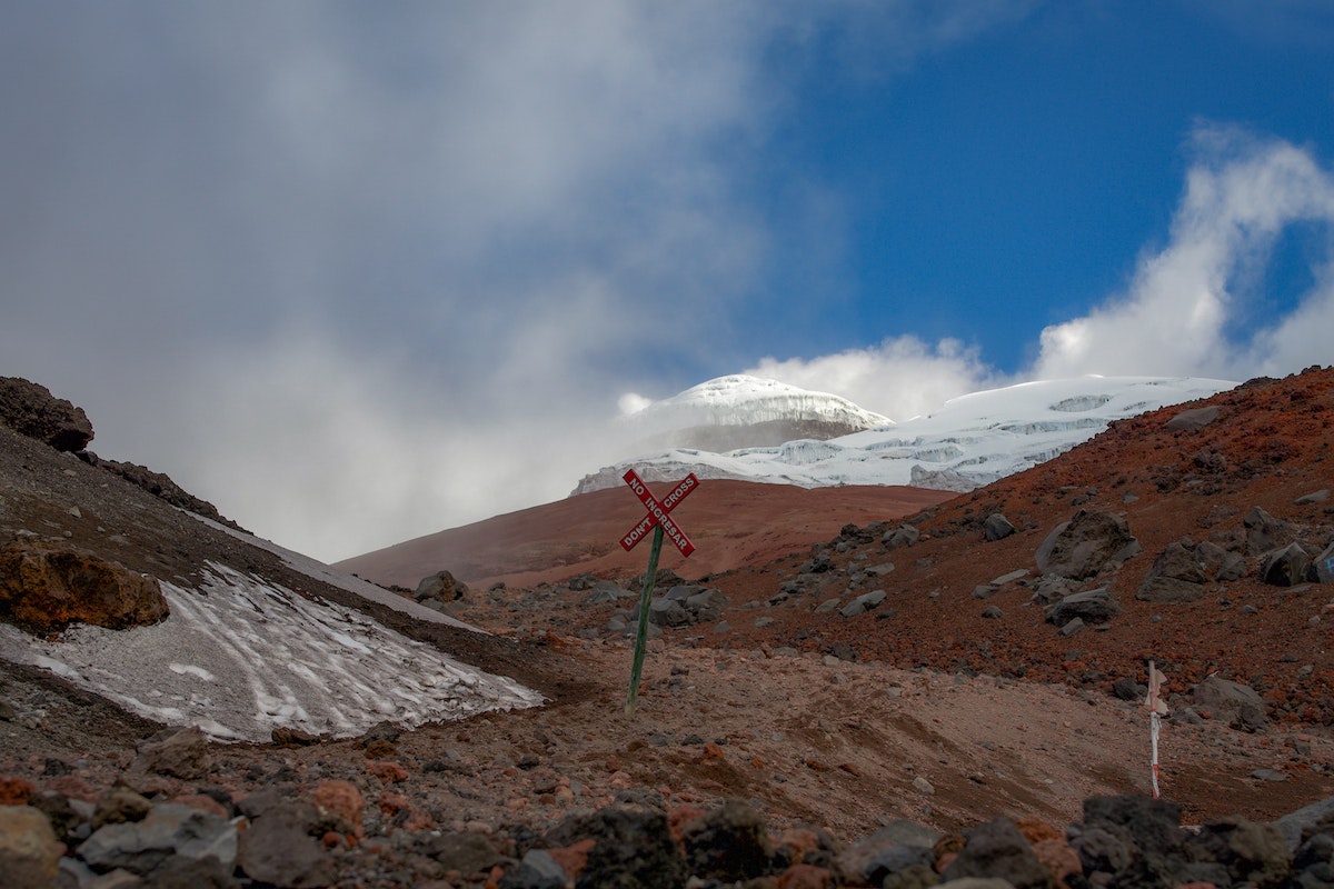One Week in Quito, Ecuador: 23 Things in 7 Days! | Cotopaxi National Park A dusted glacier on a brown mountain, Cotopaxi in Quito, Ecuador.