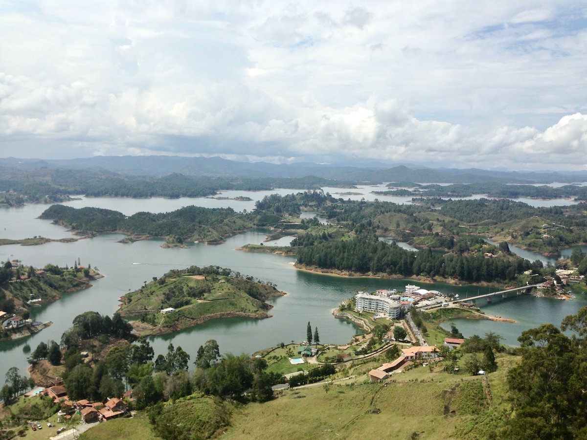 13 Brilliant Weekend & Day Trips From Medellin | El Penol day trip A stunning bird's eye landscape of small green islands surrounding a bridge over a body of water