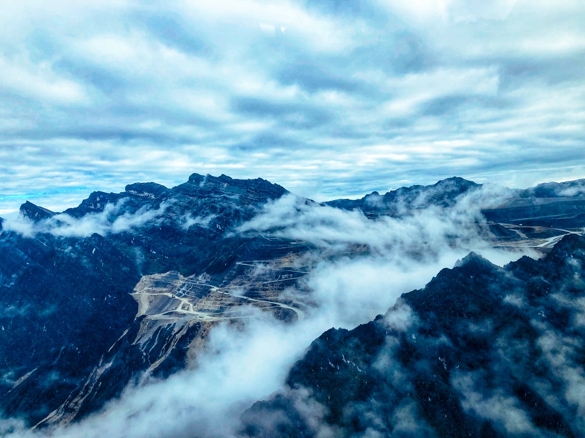 Climbing Puncak Jaya: How To Summit Carstensz Pyramid | Gold mine above Puncak Jaya A view of Grasberg Mine from Puncak Jaya