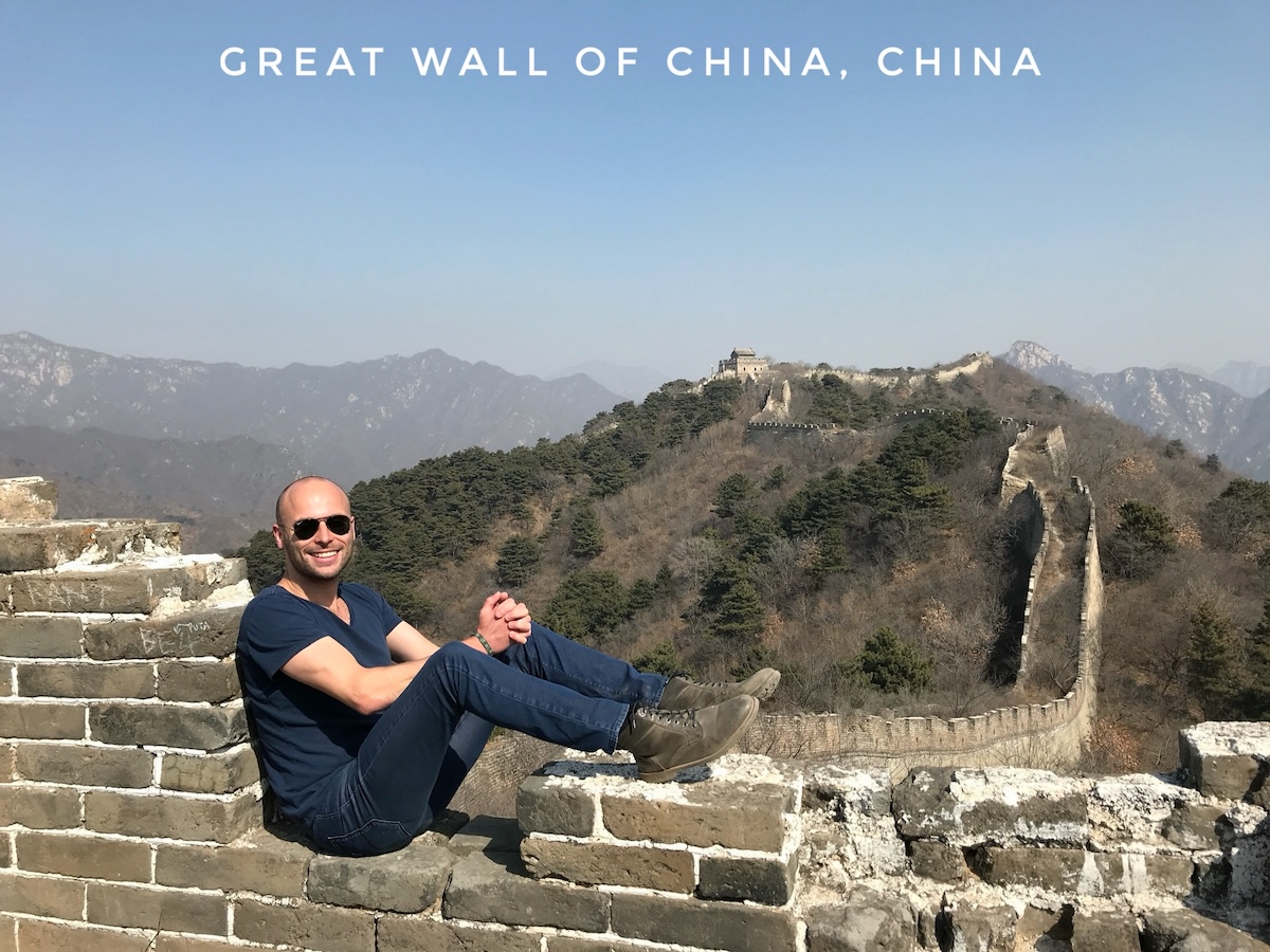 Ranking The New Seven Wonders Of The World From Worst To Best | Great Wall of China A male tourist poses on a messy part of the Great Wall of China
