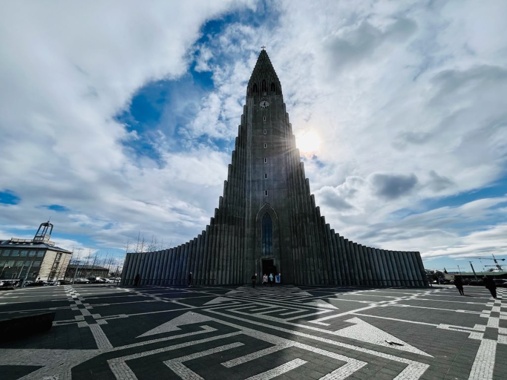 Is Iceland Worth Visiting or Overhyped? Honest Verdict After 150 Countries | Hallgrimskirkja Church Reykjavik Hallgrímskirkja, a unique-looking church in Reykjavik, inspired by Iceland's volcanic landscape.