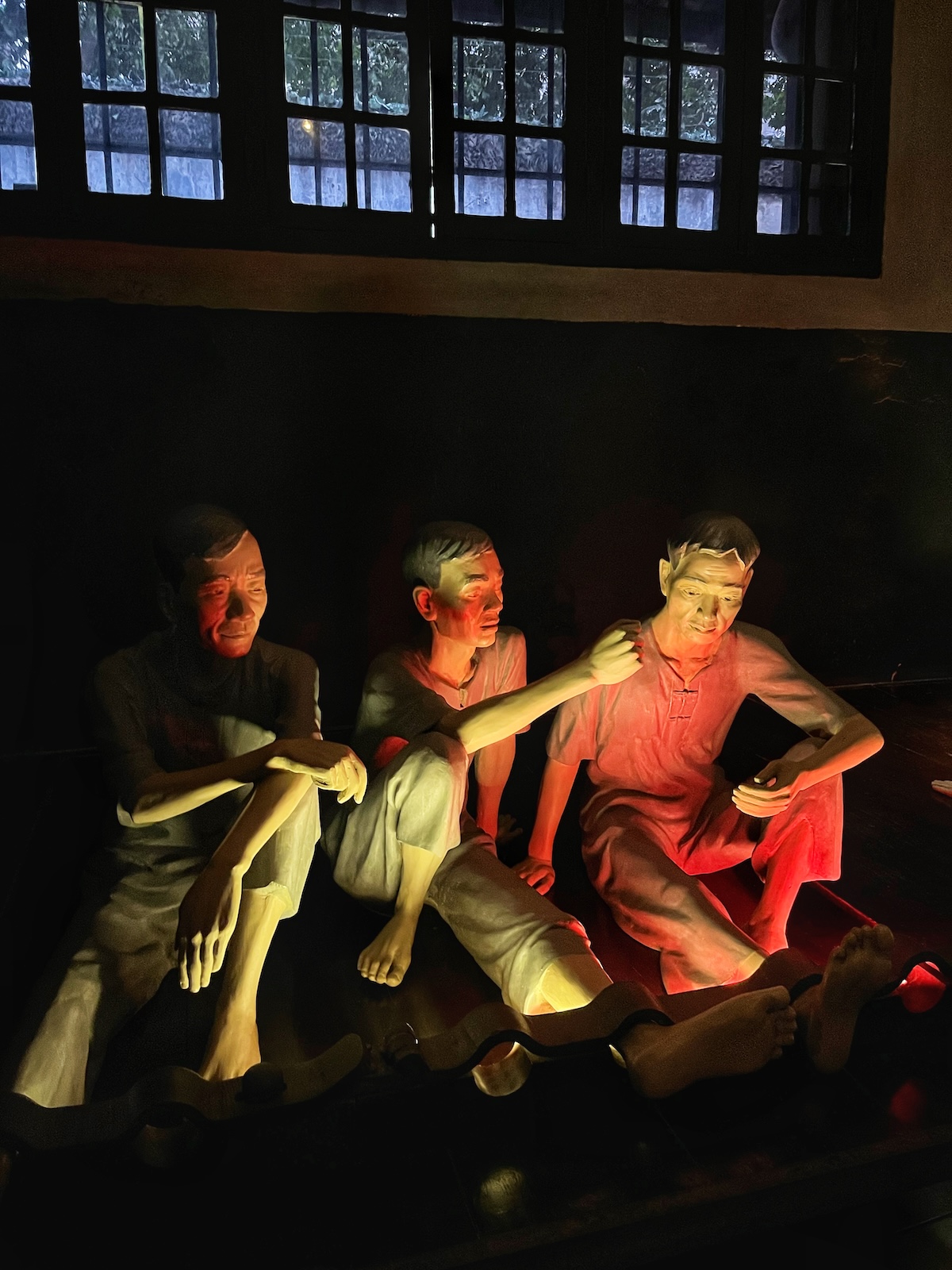 One Day in Hanoi Itinerary: No Transport Needed (Walking Only!) | Hoa Lo Prison Museum Figures of 3 male prisoners in Hoa Lo Prison Museum, Hanoi
