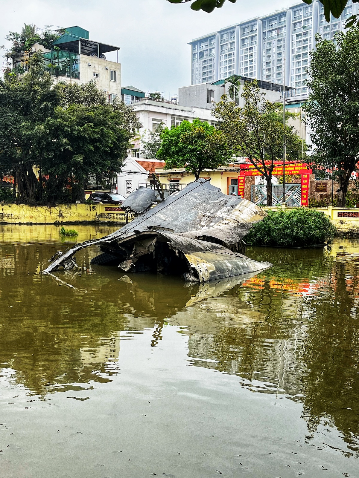 One Day in Hanoi Itinerary: No Transport Needed (Walking Only!) | Huu Tiep Lake B 52 site Wreckage of a downed B-52 in Huu Tiep Lake, Hanoi, Vietnam