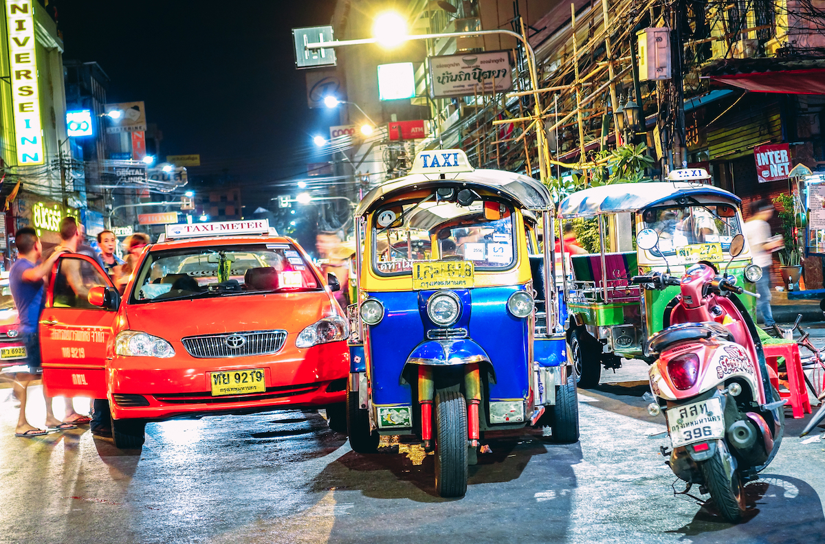 Cost of Living in Bangkok (& The Lies That Bloggers Tell) | Khao San Road Bangkok Road street life and traffic with tuk-tuk rickshaw taxis near Khao San Road Bangkok in Thailand