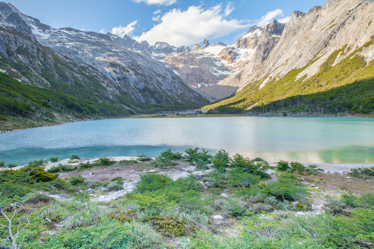 23 Best Things To Do in Ushuaia, Argentina | Laguna Esmeralda A beautiful turquoise lake compliment surrounding mountains in Lake Esmeralda