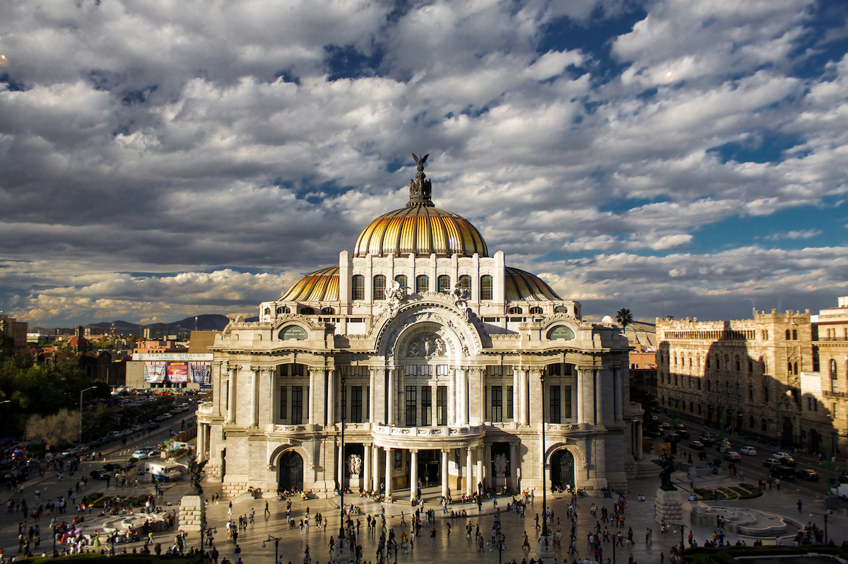 Detailed Digital Nomad Mexico City Guide For 2024 | Mexico City Palacio Del Bellas Artes A large gold-domed building during the day in Mexico City