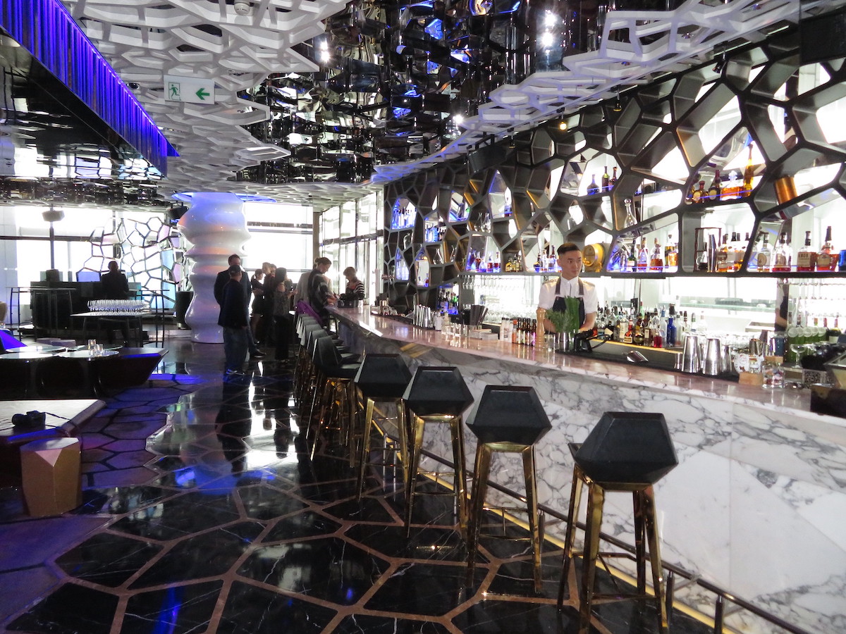 The Ultimate Hong Kong Bucket List: 25 Best Things To Do! | Ozone Worlds Highest Bar Inside a fancy cocktail bar in Hong KongSour d