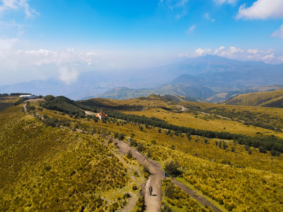 One Week in Quito, Ecuador: 23 Things in 7 Days! | Pichincha hike Hiker in the green valley of Pichincha in Quito, Ecuador.