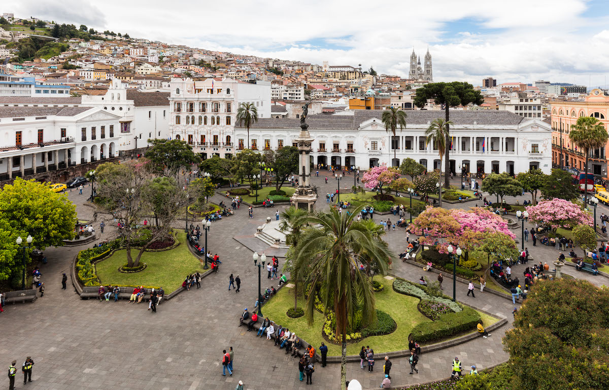 One Week in Quito, Ecuador: 23 Things in 7 Days! | Plaza Grande Quito Ecuador A busy park overlooking a white building in Quito, Ecuador.