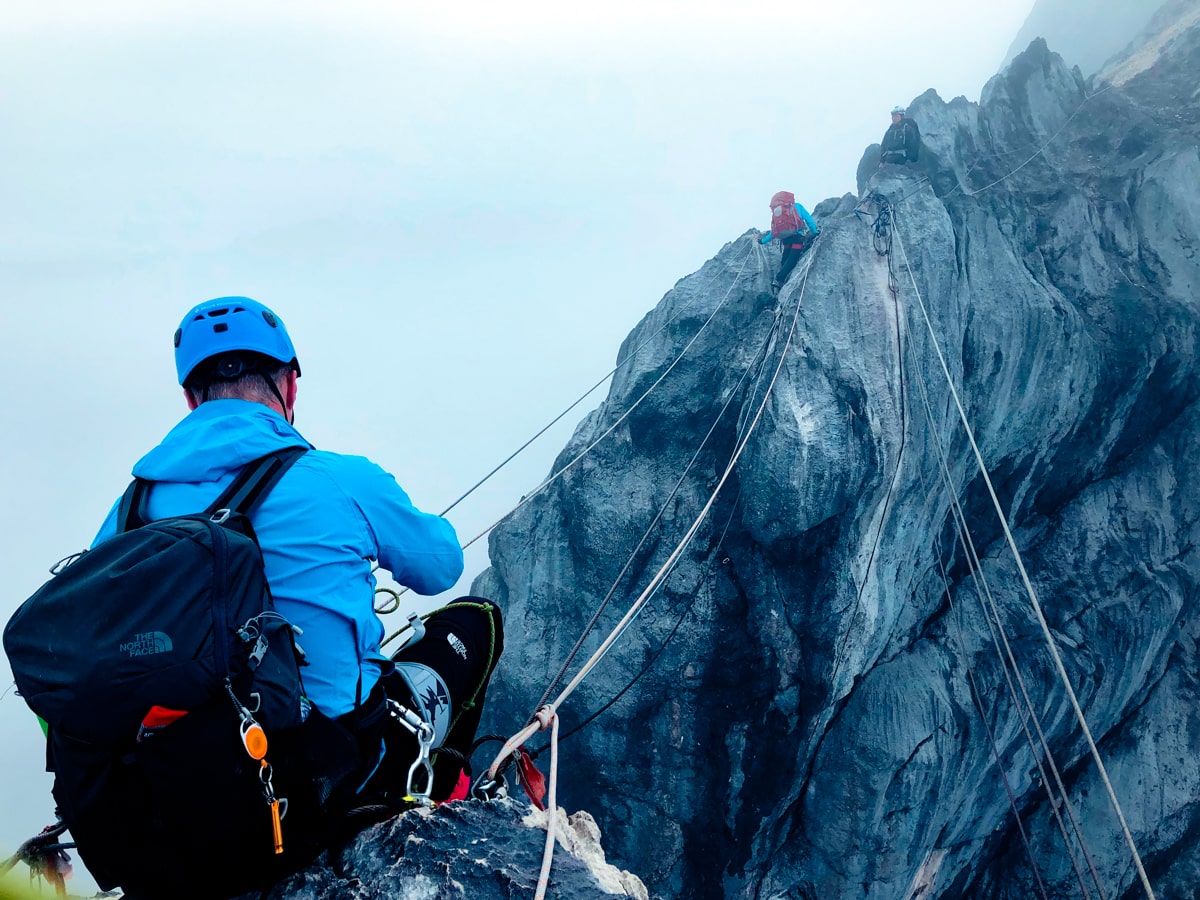 Climbing Puncak Jaya: How To Summit Carstensz Pyramid | Preparing for rope bridge Puncak Jaya 1 A climber gets ready to cross the rope bridge on Puncak Jaya