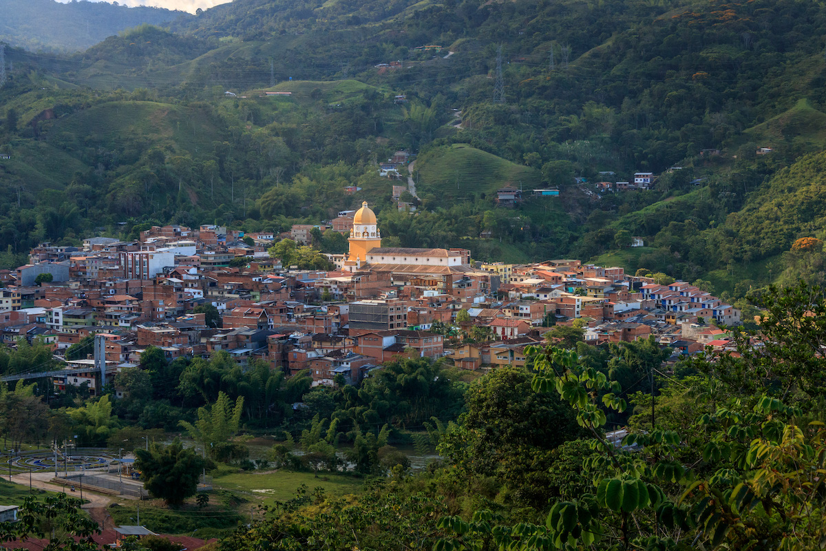 13 Brilliant Weekend & Day Trips From Medellin | San Rafael Colombia A gold-domed building stands out amongst multiple buildings in the town of San Rafael, just outside of Medellin in Colombia