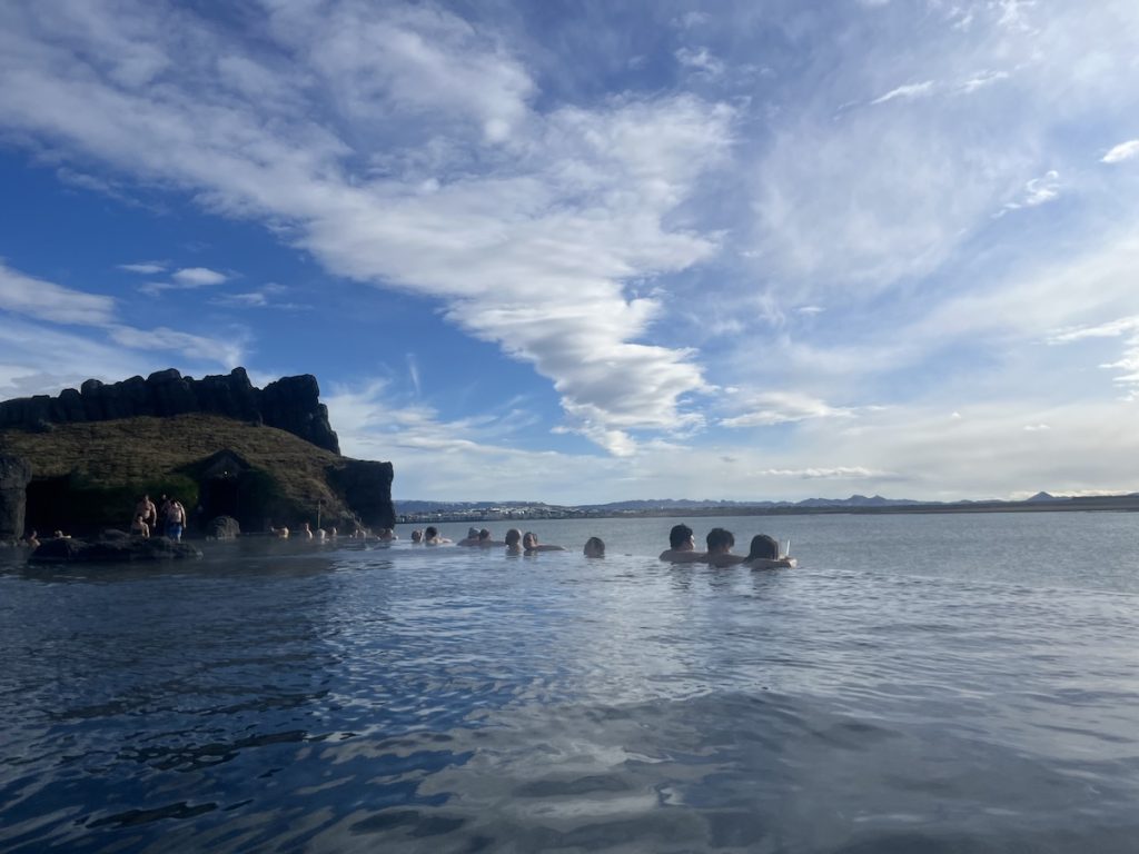 Is Iceland Worth Visiting or Overhyped? Honest Verdict After 150 Countries | Sky Lagoon views Tourists chill in hot springs in Iceland