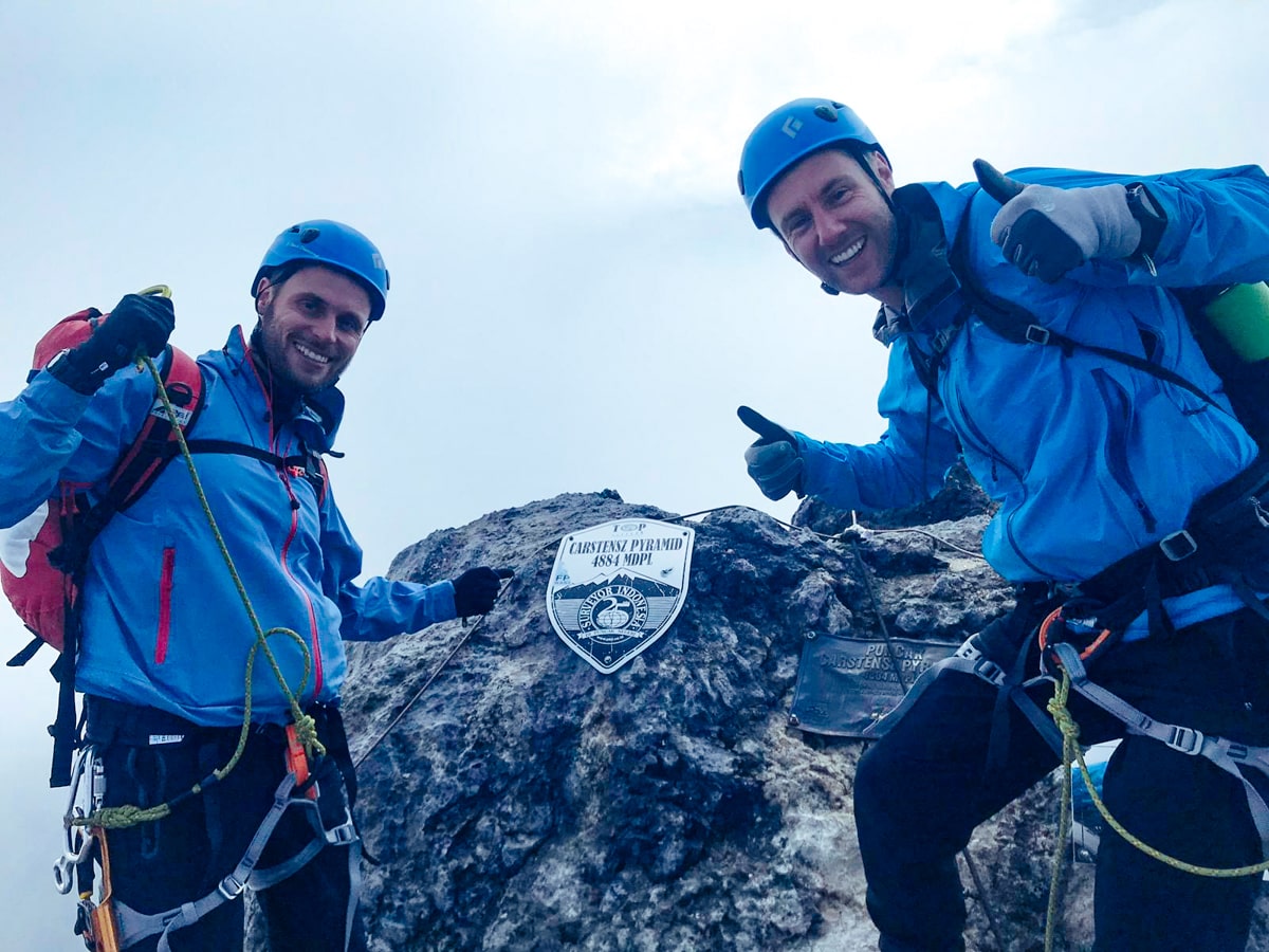 Climbing Puncak Jaya: How To Summit Carstensz Pyramid | Summiting Puncak Jaya 1 Climbers celebrate at the summit of Puncak Jaya