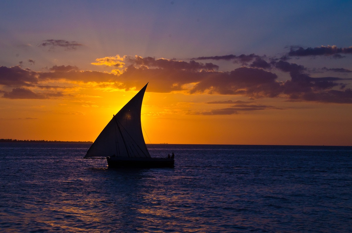 The 6 Best Sunset Spots in Zanzibar | Sunset Dhow Cruise Zanzibar A dhow boat at sunset in Zanzibar, East Africa