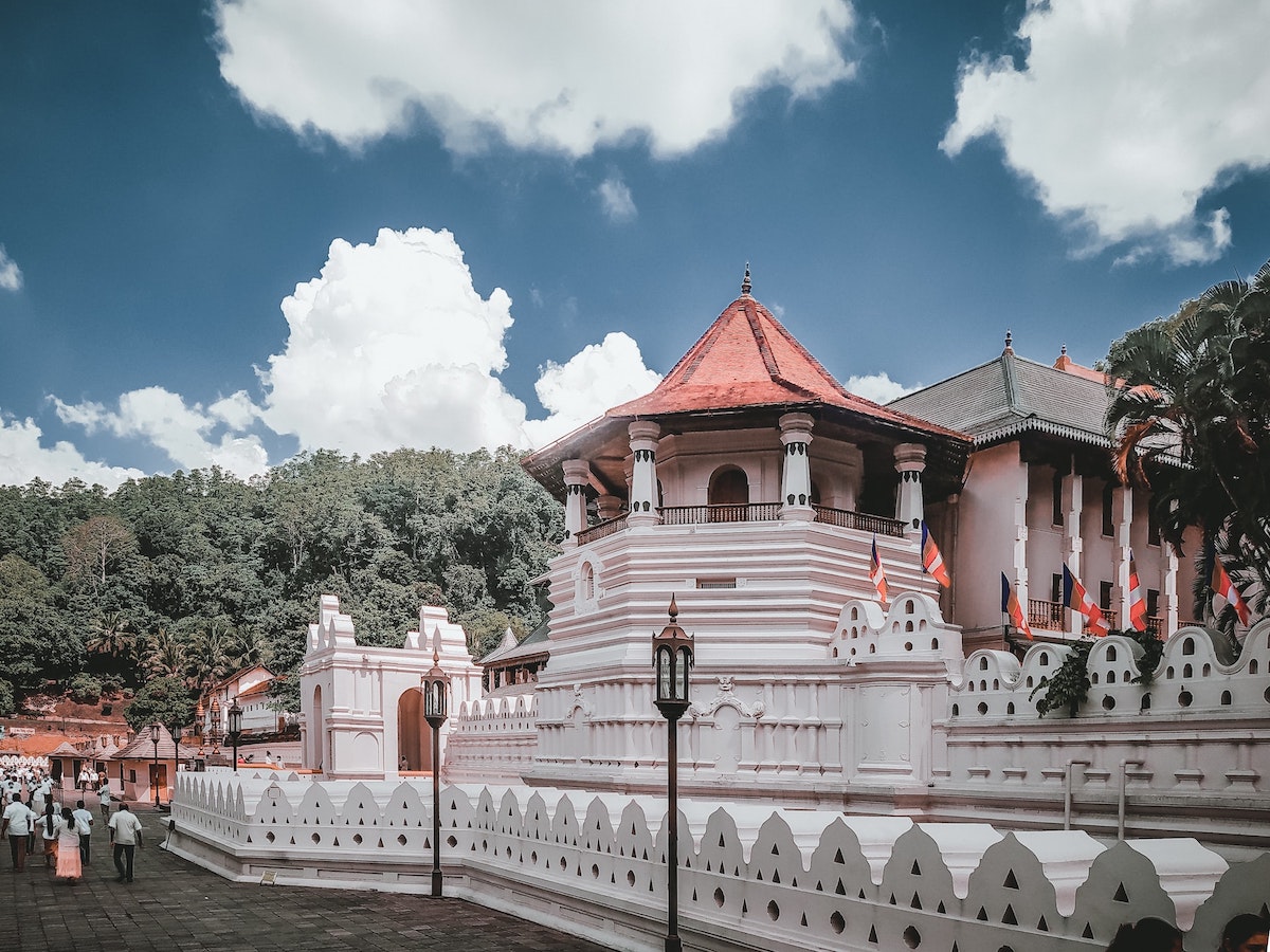 2 Weeks in Sri Lanka Itinerary For First-Timers | Temple of the Sacred Tooth Relic A beautiful white temple in Kandy, Sri Lanka.