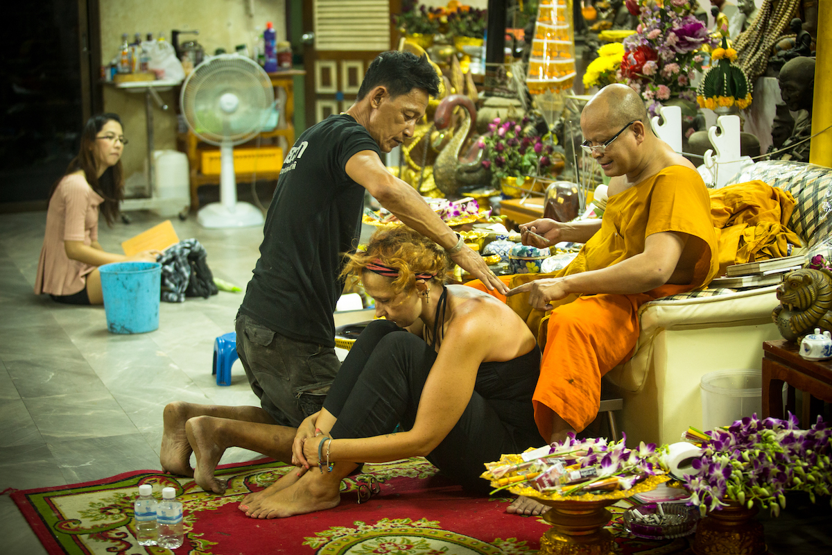 17 Best Thailand Festivals (That You May Never Heard Of) | Thailand tattoo festival A monk makes traditional tattooing at a Thai festival.
