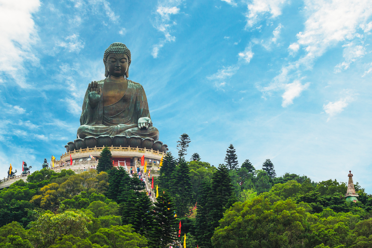 The Ultimate Hong Kong Bucket List: 25 Best Things To Do! | Tian Tan Buddha The enormous Tian Tan Buddha statue at Po Lin Monastery in Hong Kong