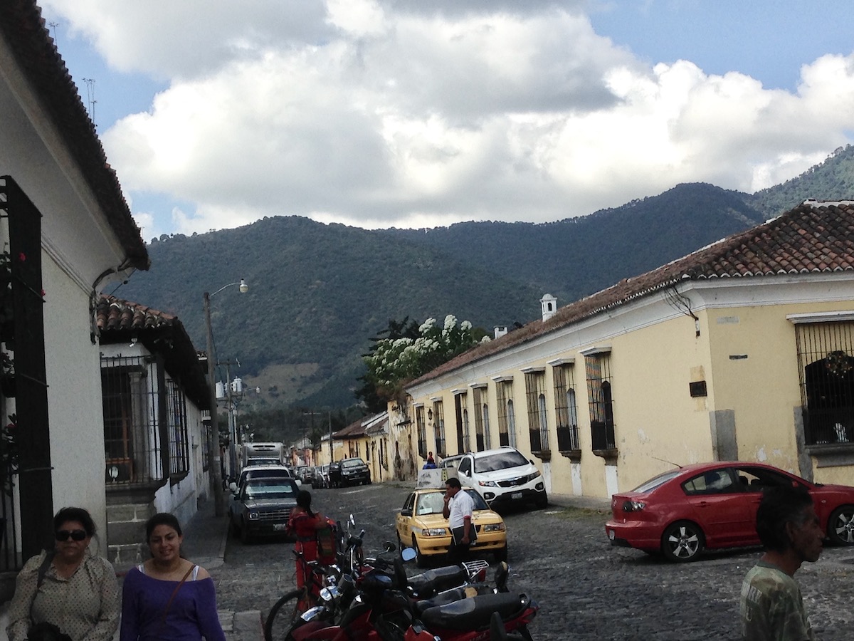 Pacaya Volcano Sunset Hike: An Honest Guide For 2024 | antigua guatemala Spanish colonial buildings on a cobbled street in Antigua, Guatemala.