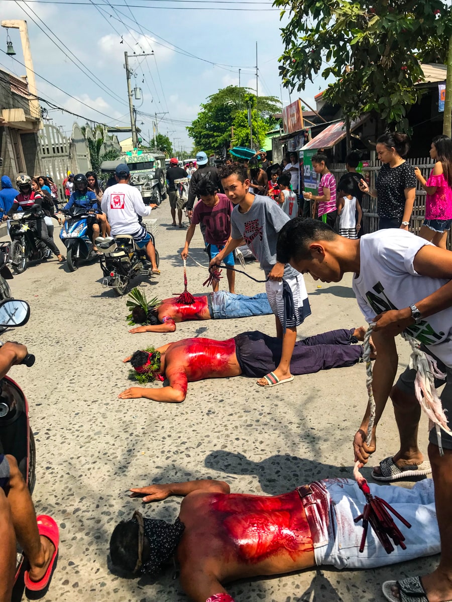 Crucifixion in the Philippines: My (Extreme) Easter Experience | bloody volunteers San Fernando City Good Friday Whipping and blood in the streets of Pampanga.