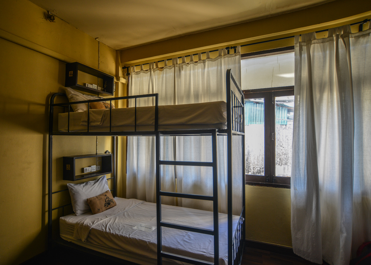 Cost of Living in Bangkok (& The Lies That Bloggers Tell) | cheap hostel Bangkok Hostel dormitory beds in a cheap room in Bangkok