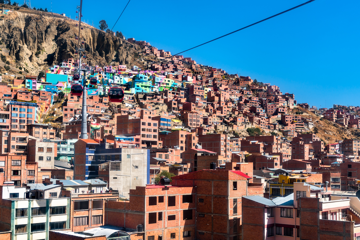 28 Best Things To Do in La Paz, Bolivia & Surrounding Areas | chualluma la paz Cable car above the colourful Chualluma district of La Paz, Bolivia