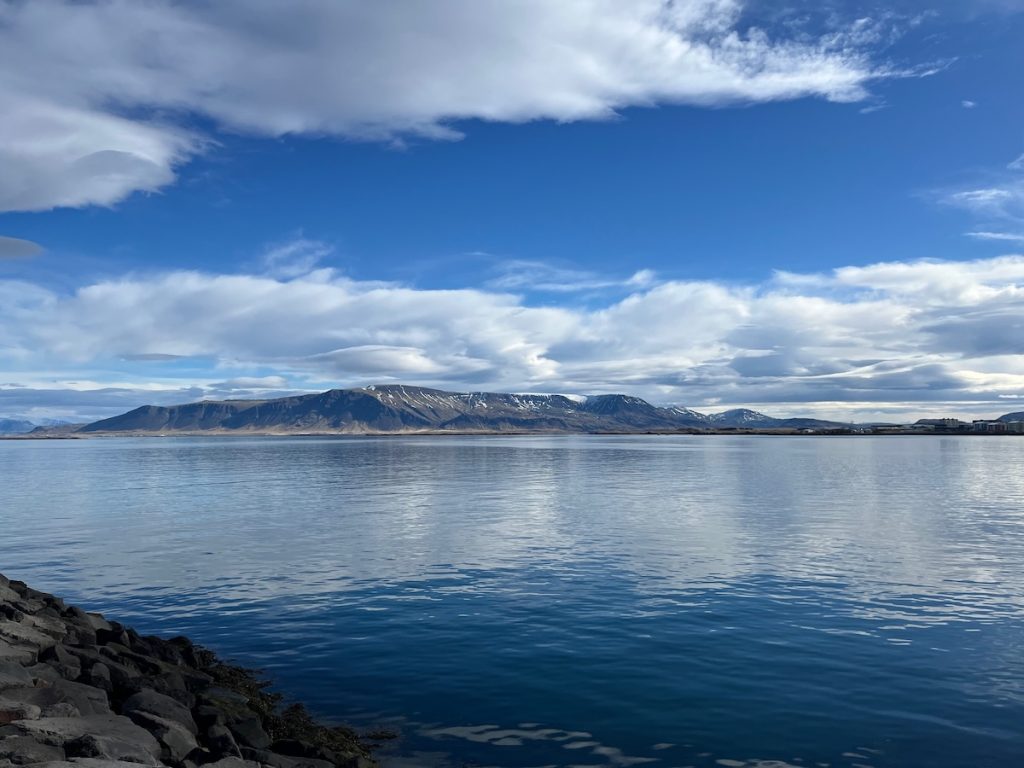Is Iceland Worth Visiting or Overhyped? Honest Verdict After 150 Countries | clean Iceland sky Clear blue sky in Iceland overlooking the ocean