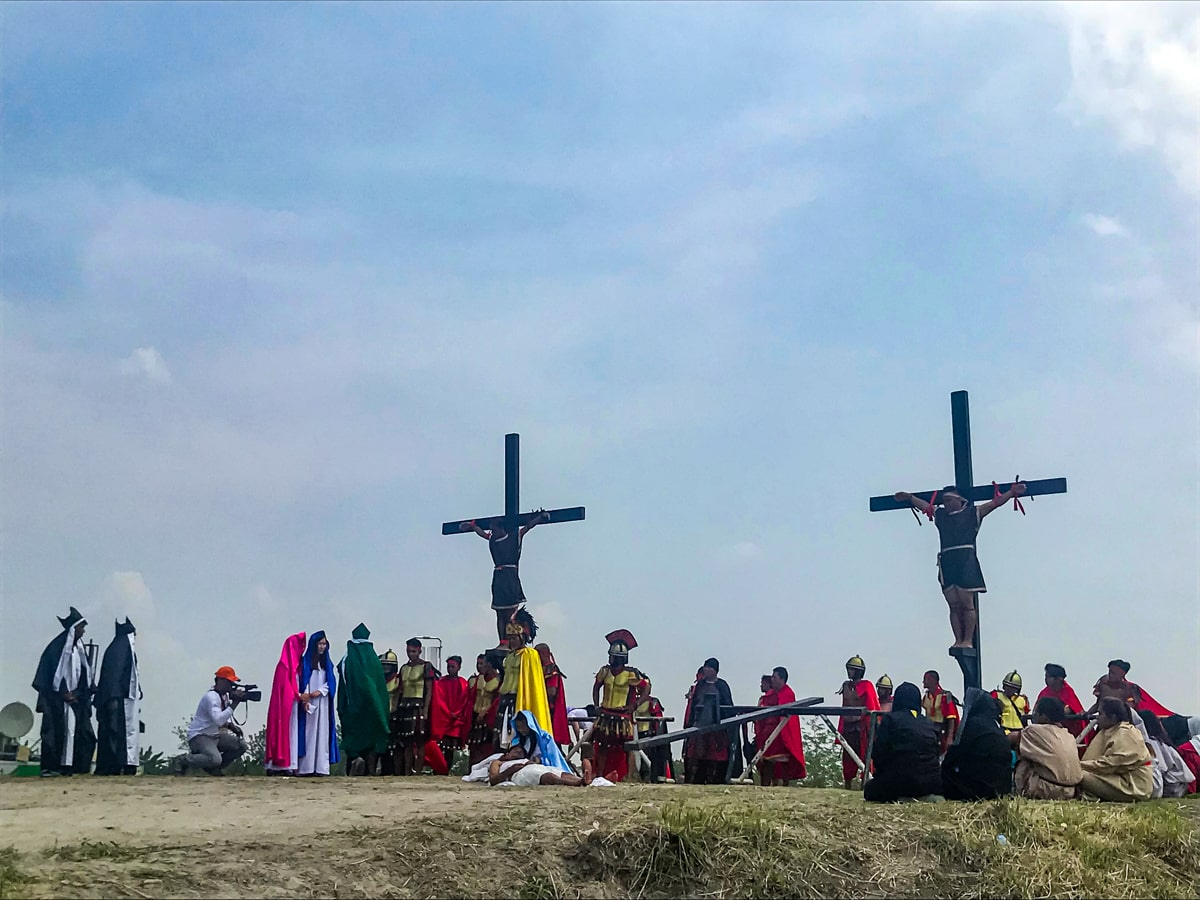 Crucifixion in the Philippines: My (Extreme) Easter Experience | crucifixion reenacment Philippines Two men reenact a crucifixion on a raised cross in Pampanga, Philippines