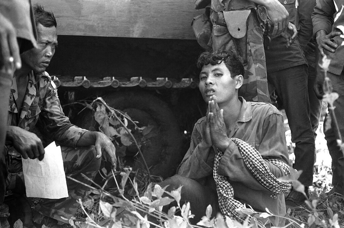 The Rise and Fall of The Khmer Rouge Regime in Cambodia | fall of Khmer Rouge A Cambodian Khmer Rouge soldier begs for mercy during interrogation by Vietnamese troops near the Vietnamese border