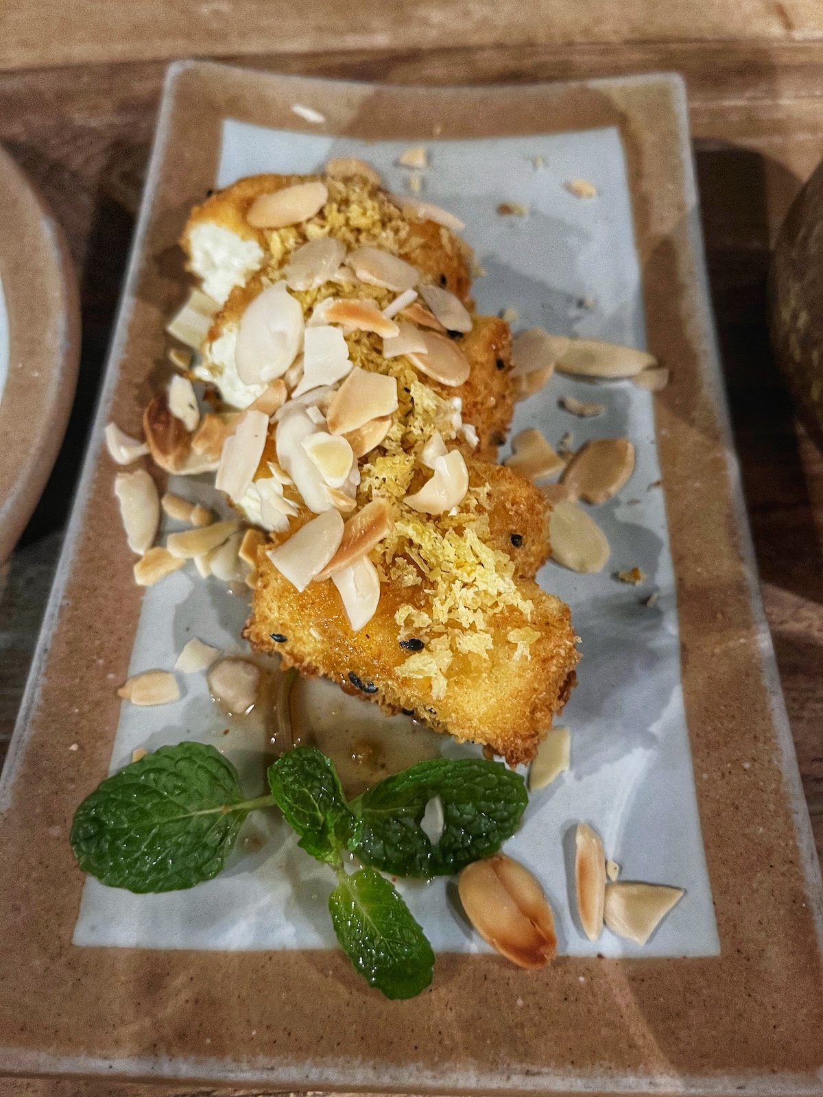 One Day in Hanoi Itinerary: No Transport Needed (Walking Only!) | food in Sadhu Vegetarian Restaurant Chopped almonds on top of marinated tofu at Sadhu Vegetarian Restaurant, Hanoi