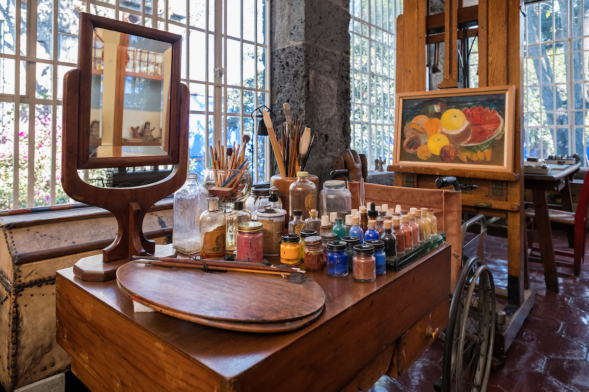16 Famous Landmarks in Mexico (& How To See Them in 2024!) | frida kahlo museum Frida Kahlo painting utensils at the Frida Kahlo Museum at Coyoacan in Mexico City.