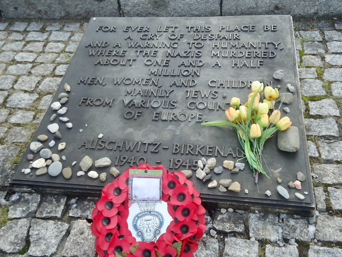 Visiting Auschwitz: All You Need To Know & What To Expect | memorial auschwitz museum 3 A memorial for the victims of Auschwitz Birkenau with reefs and flowers