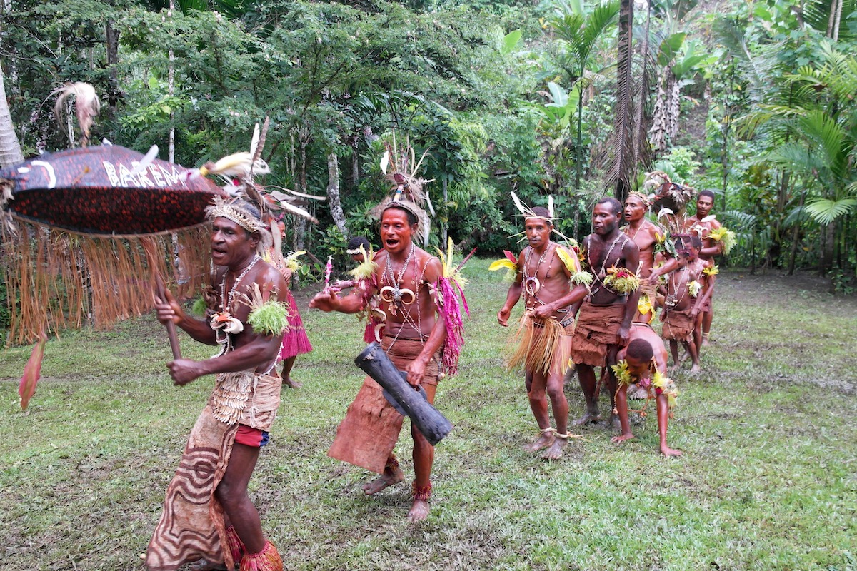 The Tribespeople of Papua New Guinea: A Detailed Guide | papua new guinea tribe dancing A tribe dances in the Papua New Guinea rainforest