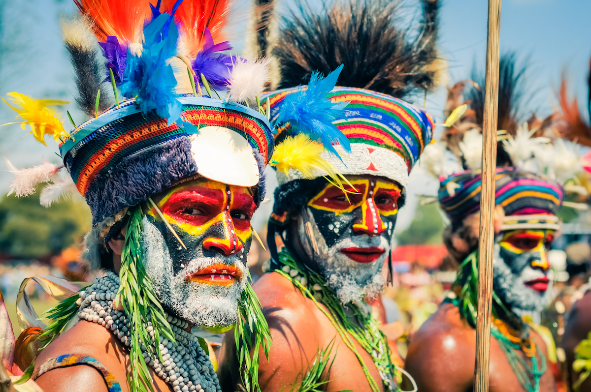 The Tribespeople of Papua New Guinea: A Detailed Guide | papua new guinea tribes Hagen show, Papua New Guinea - Two native half-naked men with colours on their faces and beards during Hagen show, Papua New Guinea. Documentary editorial.